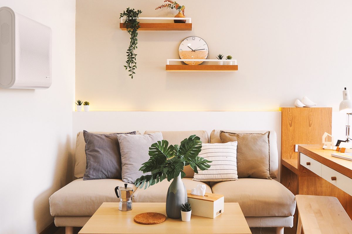 Air purifier running in a small apartment living room