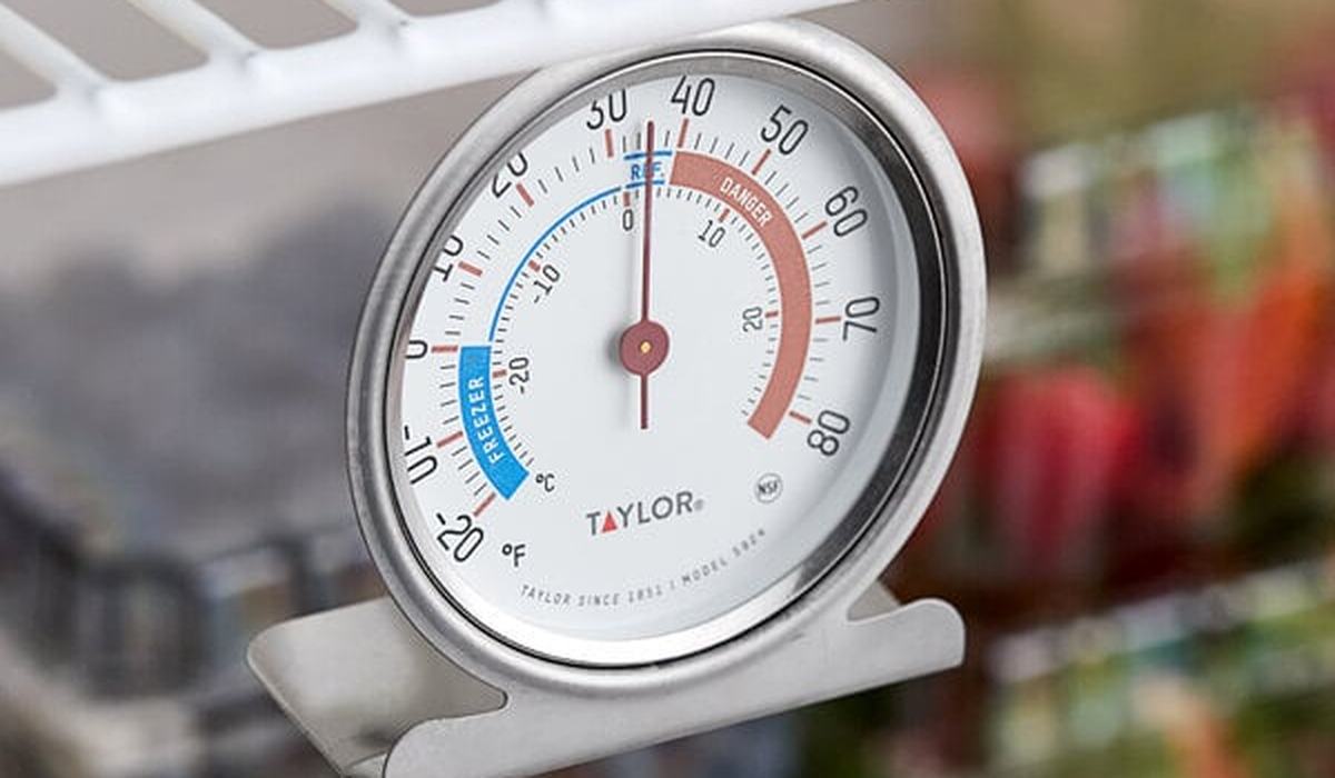 Thermometer inside a refrigerator checking the temperature