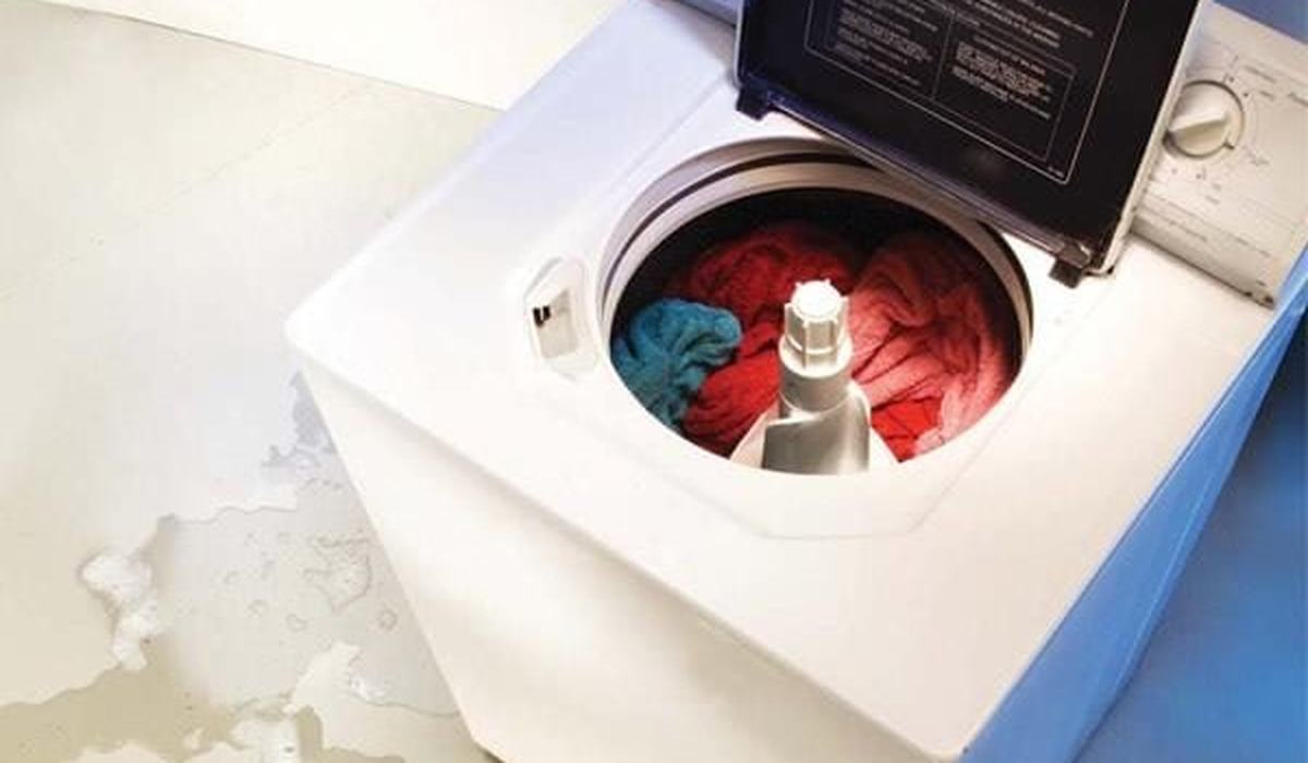Washing machine with the door open during a cleaning cycle